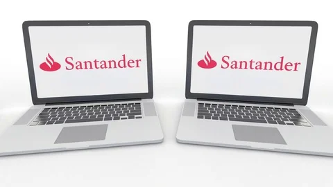 Notebooks with Santander Serfin logo on the screen. Computer technology Stock Footage 73177400