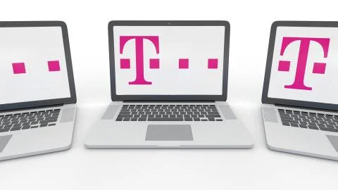 Notebooks with T-Mobile logo on the screen. Computer technology conceptual Stock Illustration