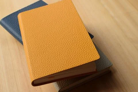 Notebooks on a wooden table Stock Photos