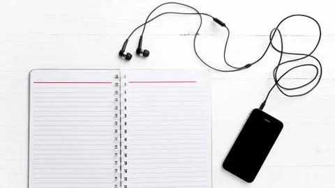 Notepad and cellphone Stock Photos