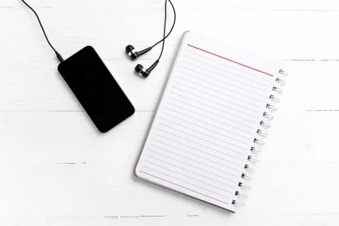Notepad and cellphone Stock Photos