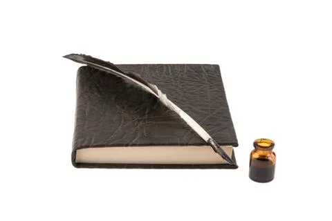 Notepad and  feather with ink Stock Photos