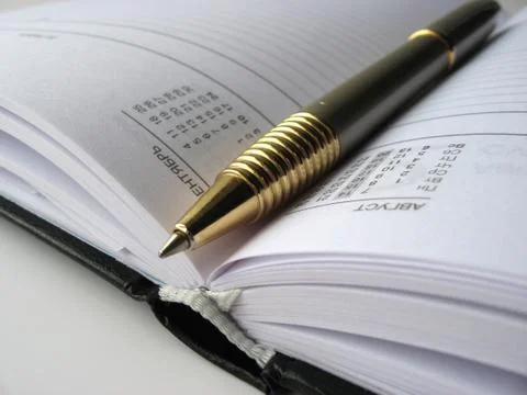 Notepad and pen Stock Photos