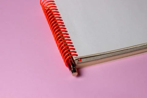 Notepad and pen on a pink background. A clean notepad.  Stock Photos