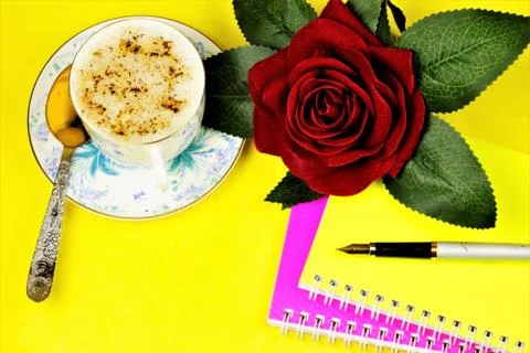 Notepad and pen for writing the author. Rose is a symbol of the holiday, Stock Photos