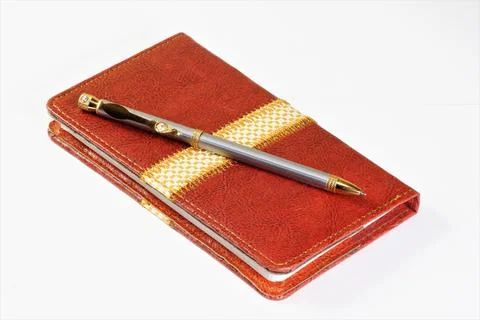 Notepad and pen for writing down the business plan and schedule in training. Stock Photos