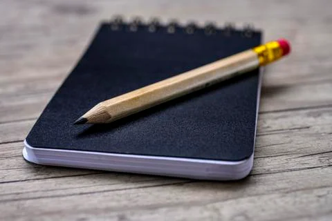 Notepad and pencil Stock Photos