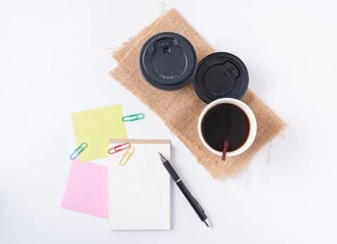 Notepad and take away coffee cup Stock Photos