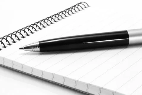 Notepad with ball pen Stock Photos