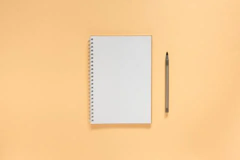 Notepad on on a beige powdery background Stock Photos