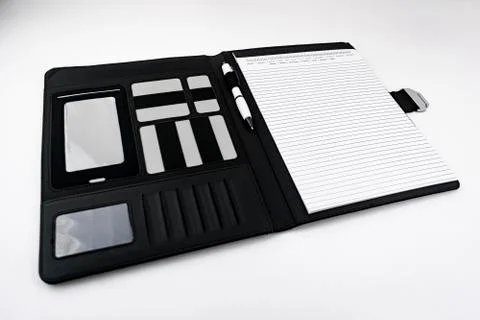 Notepad in a black leather folder with built-in pen Stock Photos