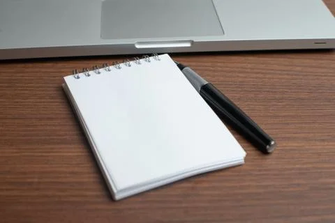 Notepad with black pen in the office Stock Photos