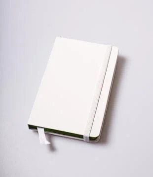 Notepad blank cover on white table Stock Photos