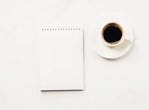 Notepad blank for to-do list or goals cup of coffee on a light background Stock Photos