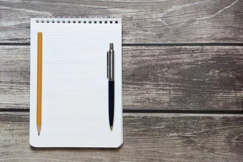 Notepad with a blank white sheet in a checker paper with ball pen and simple  Stock Photos