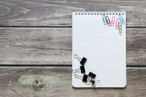 Notepad with a blank white sheet in a checker paper with a clip and with pape Stock Photos