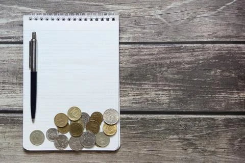 Notepad with a blank white sheet in a checker paper with russian coins and ba Stock Photos