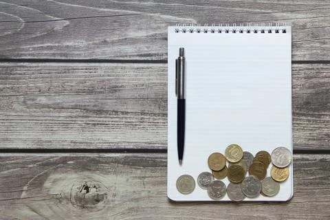 Notepad with a blank white sheet in a checker paper with russian coins and ba Stock Photos