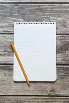 Notepad with a blank white sheet in a checker paper with simple graphite penc Foto stock