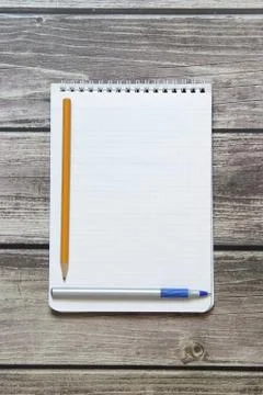 Notepad with a blank white sheet in a checker paper with ball pen and simple  Stock Photos