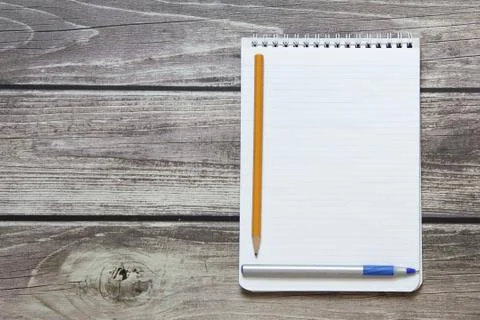 Notepad with a blank white sheet in a checker paper with ball pen and simple  Stock Photos