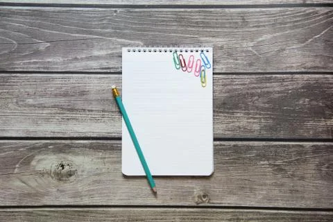 Notepad with a blank white sheet in a checker paper with simple graphite penc Foto stock