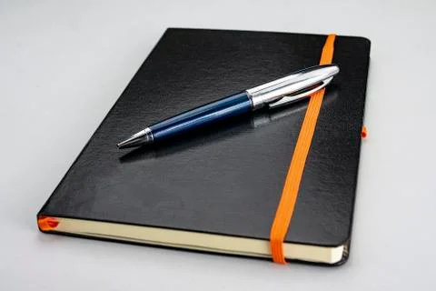 Notepad with blue modern pen Stock Photos
