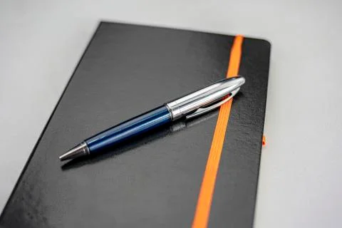 Notepad with blue modern pen Stock Photos