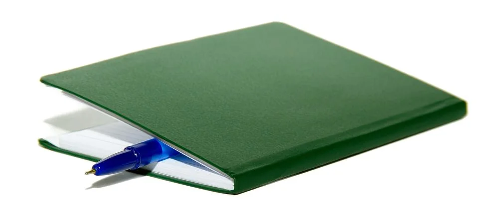 Notepad book and pen Stock Photos