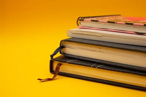 Notepad on a bright yellow background, sheets of paper, words on paper Stock Photos