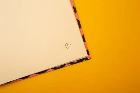 Notepad on a bright yellow background, sheets of paper, words on paper Stock Photos