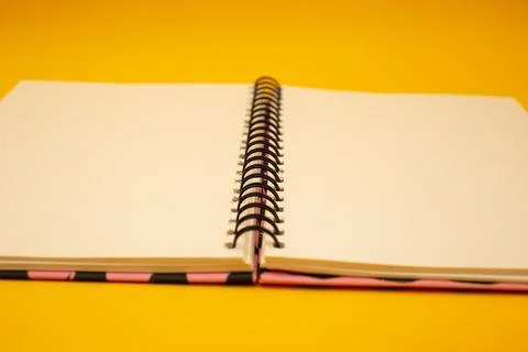 Notepad on a bright yellow background, sheets of paper, words on paper Stock Photos