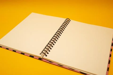 Notepad on a bright yellow background, sheets of paper, words on paper Stock Photos