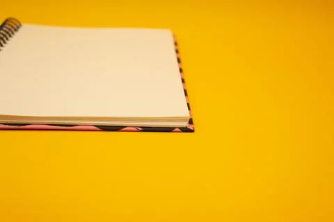 Notepad on a bright yellow background, sheets of paper, words on paper Stock Photos