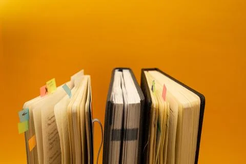 Notepad on a bright yellow background, sheets of paper, words on paper Stock Photos