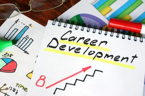 Notepad with Career Development on a wooden surface. Stock Photos