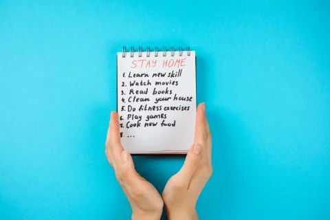 Notepad with check list what to do while staying at home on covid-19 quarantine Stock Photos