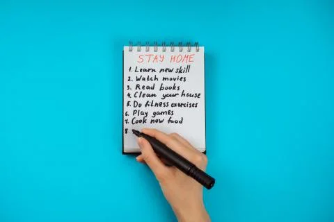 Notepad with check list what to do while staying at home on covid-19 quarantine Stock Photos