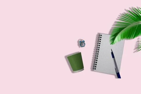 Notepad with coffee and an alarm clock on a light background. Stock Photos