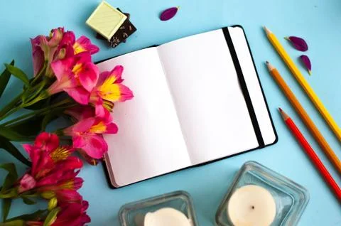 Notepad on color background Stock Photos