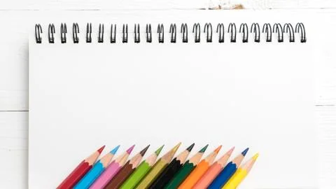 Notepad with color pencil Stock Photos