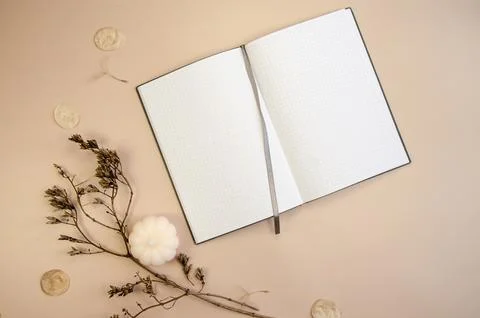 Notepad copyspace on tan begie background  with dry brown branches. Autumn minim 스톡 사진