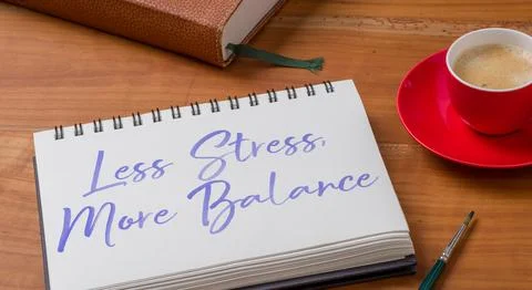A Notepad on a desk - Less Stress, More Balance Stock Photos