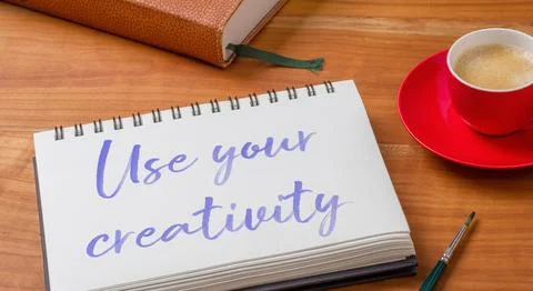 Notepad on a desk - Use your creativity Stock Photos