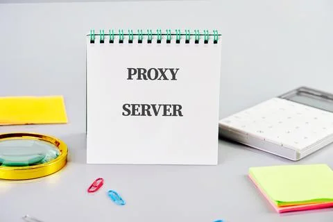A notepad displays the term proxy server alongside office supplies, highlight Stock Photos