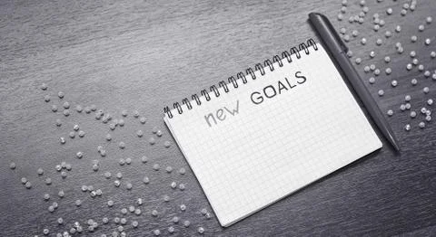 Notepad for entries on the table. Handle and paper on a wooden s Foto stock