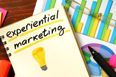 Notepad with experiential marketing on the table. Stock Photos