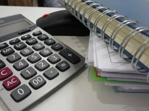 Notepad, file document, calculator in office Stock Photos