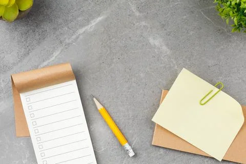 Notepad on gray marble background. Stock Photos