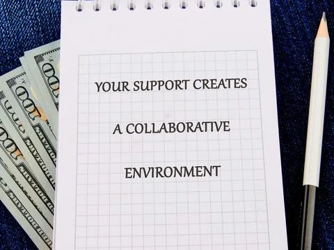 A notepad with a grid pattern features the text your support creates a collab Stock Photos